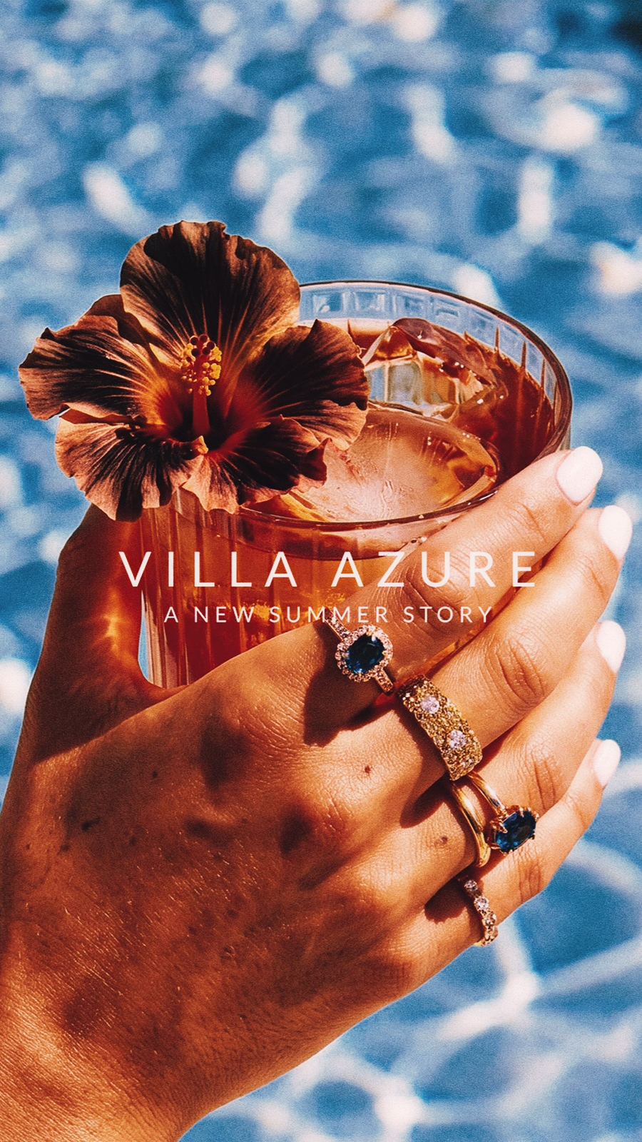 Villa Azure key visual: poolside cocktail with hibiscus and a summer-story lockup